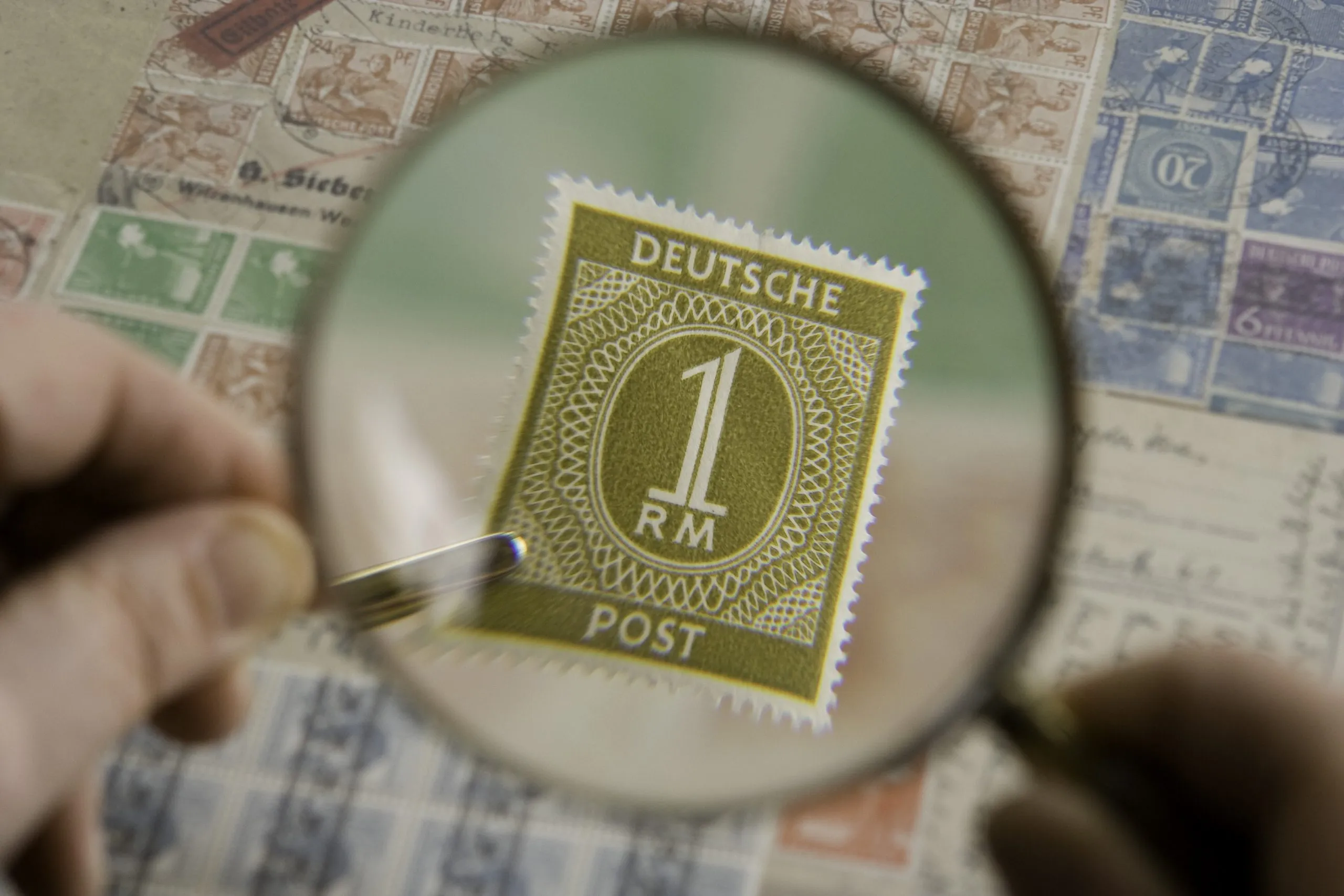 Magnification Of Stamp With The Help Of Magnifying Glass